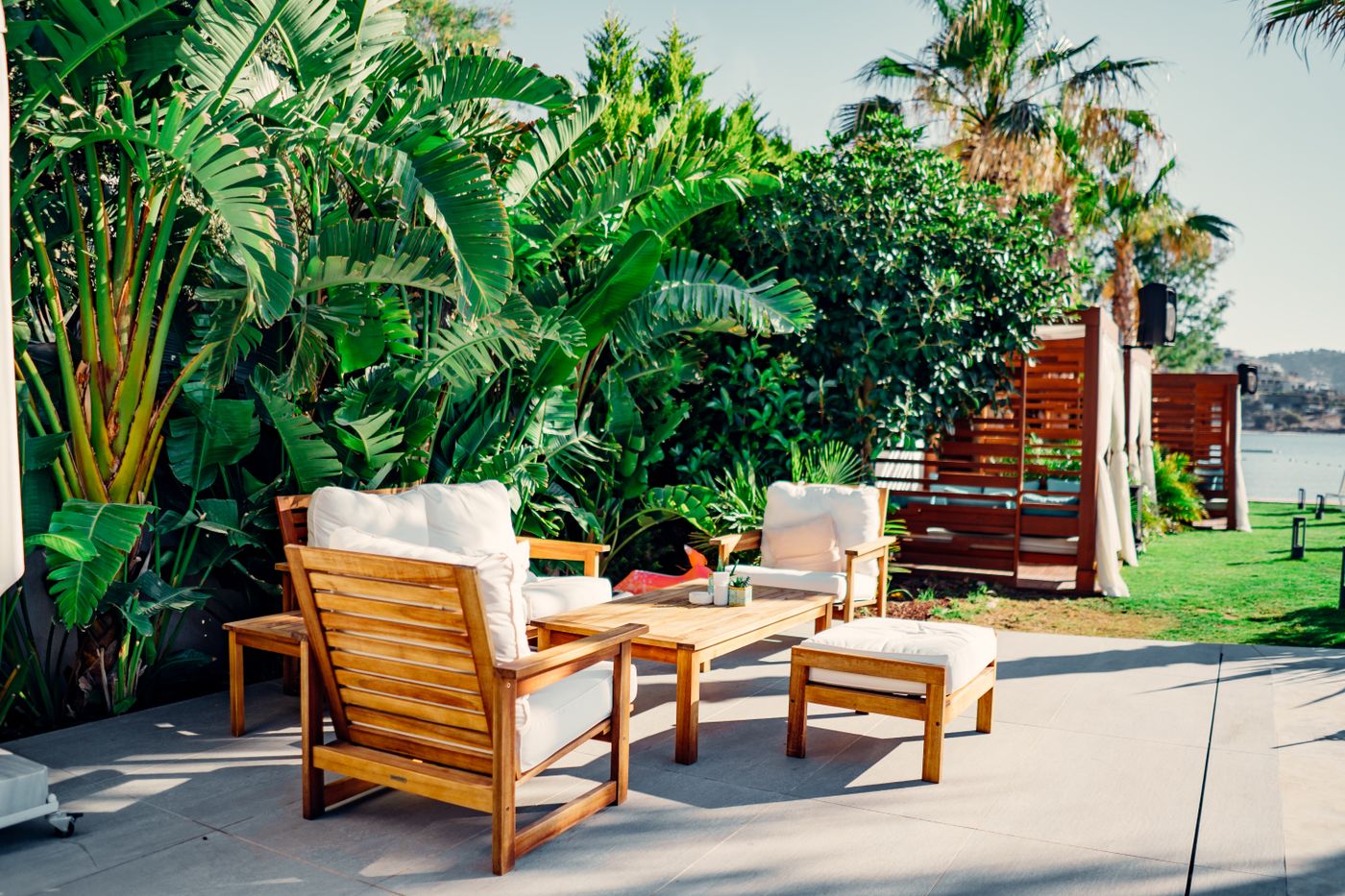 Outdoor patio room with wood furniture